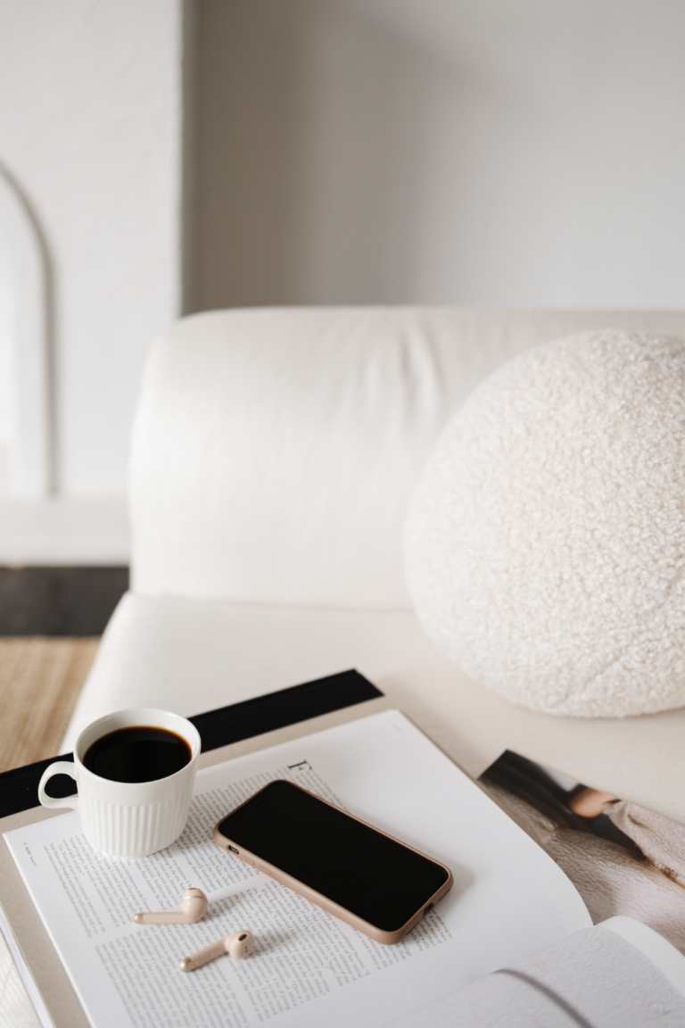 A hand placing a single block in a stack, symbolizing the incremental growth and impact of positive habits.